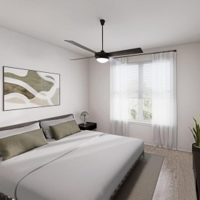 a bedroom with a bed and a lamp