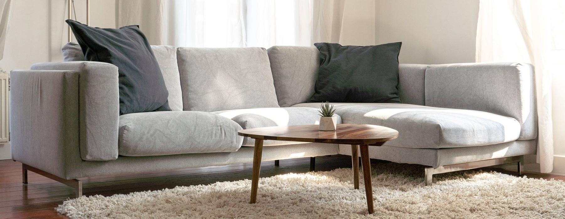 oversized windows brighten spacious, furnished living room